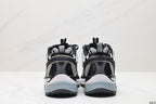 Rear view showing pull tabs, black heel panels, and pale blue-grey outsole sections.
