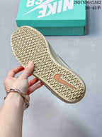 Close-up of the patterned beige-toned outsole with a Nike Swoosh