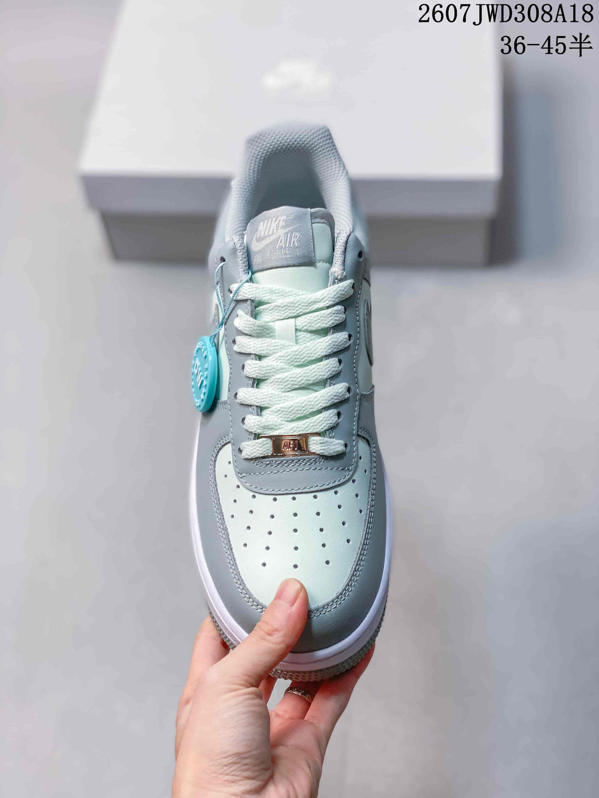 Top view showing the perforated toe box, white laces, tongue label and lace tag.