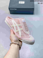 Pink Onitsuka Tiger Mexico 66 Sabot sneaker with light side stripes, shown with its box; the image shows style code 2604JDY297A25 and size range 36–45.