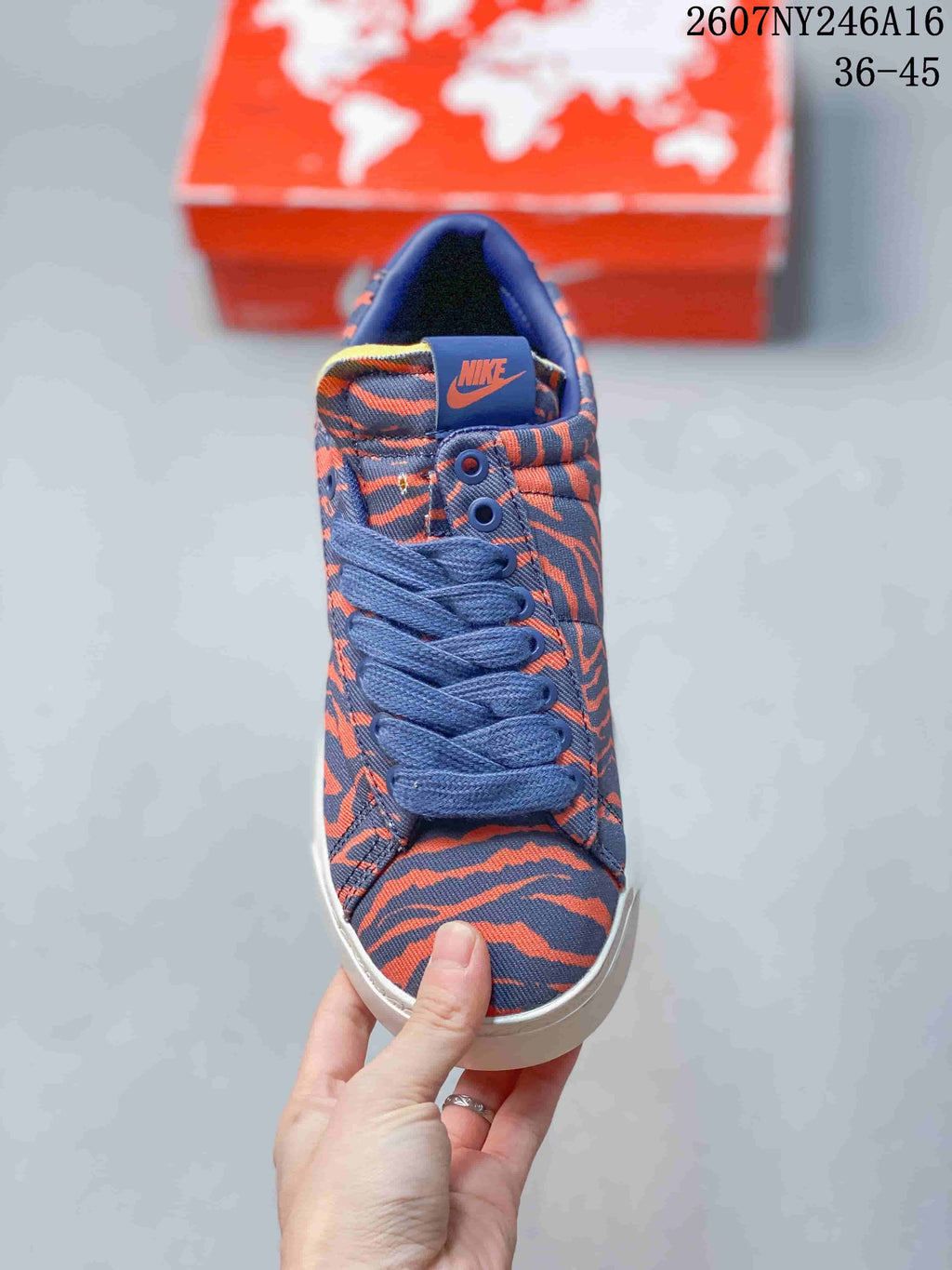 Top view showing the blue laces, patterned toe box and Nike tongue label.