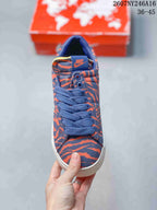 Top view showing the blue laces, patterned toe box and Nike tongue label.