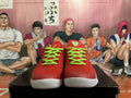 Front view of red Nike Kobe basketball shoes with bright green laces and white outsoles