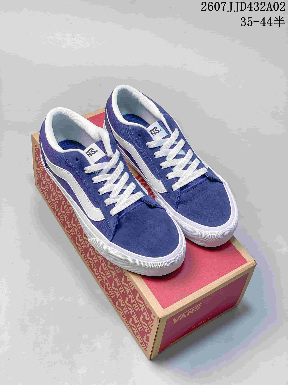 Blue and white Vans Vero LS low-top sneakers shown on a shoe box