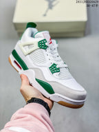 Close-up of a white and green sneaker showing the mesh side panel, lace wings, layered upper, and textured outsole.