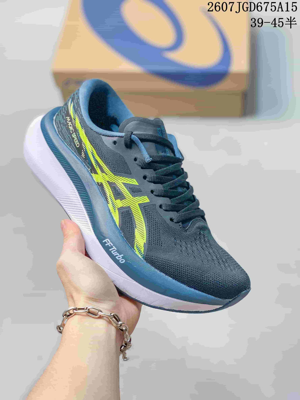 Dark blue and black ASICS running shoe with bright yellow-green branding and a white midsole.