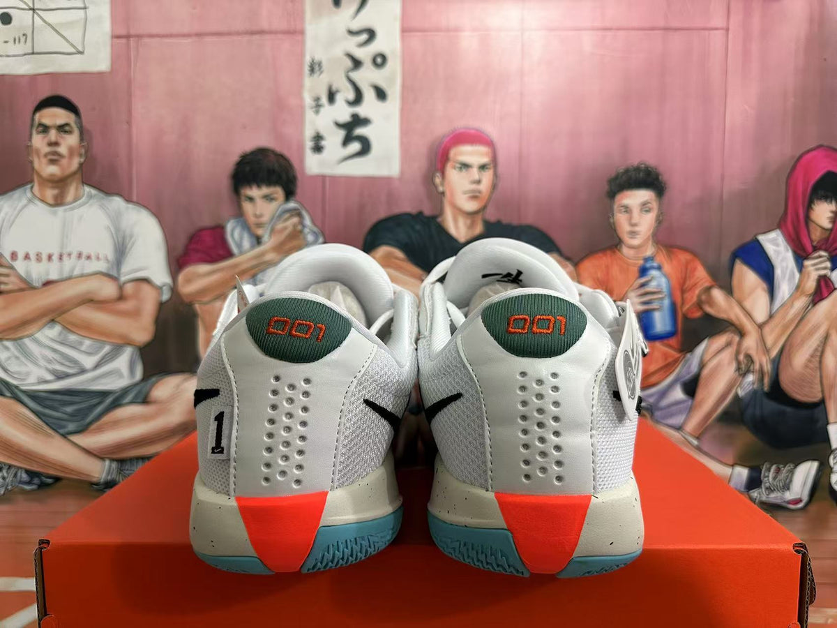 Rear view of white Nike basketball sneakers with green heel panels, red accents, blue-green outsoles, and perforated heel sections.