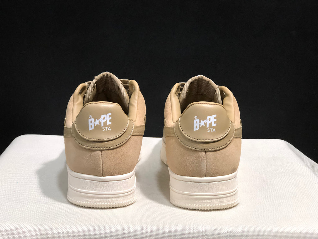 Rear view of the pair showing BAPE STA heel branding and padded collars.