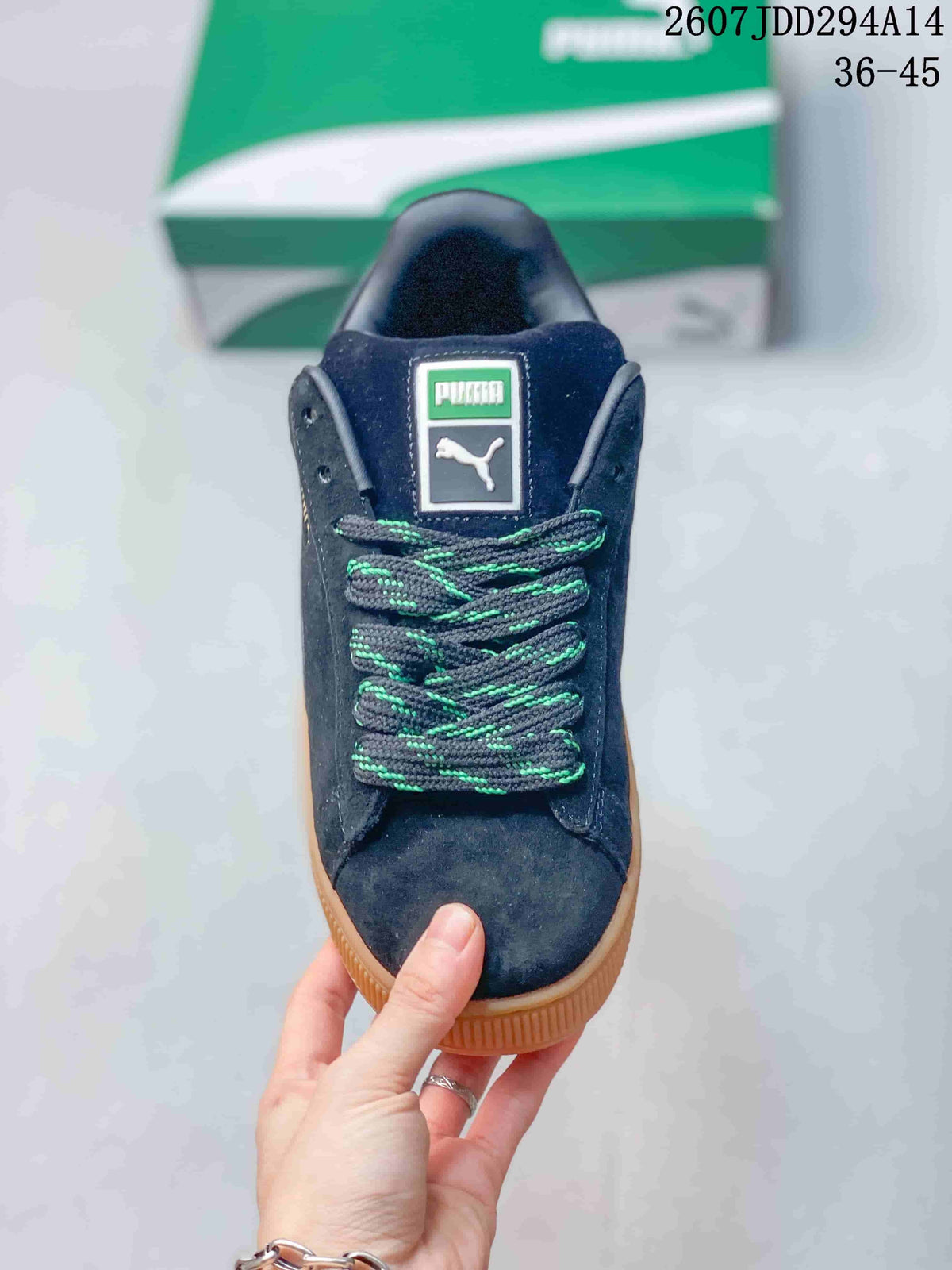 Top view showing the dark toe, tongue branding, and green-accented lace pattern.
