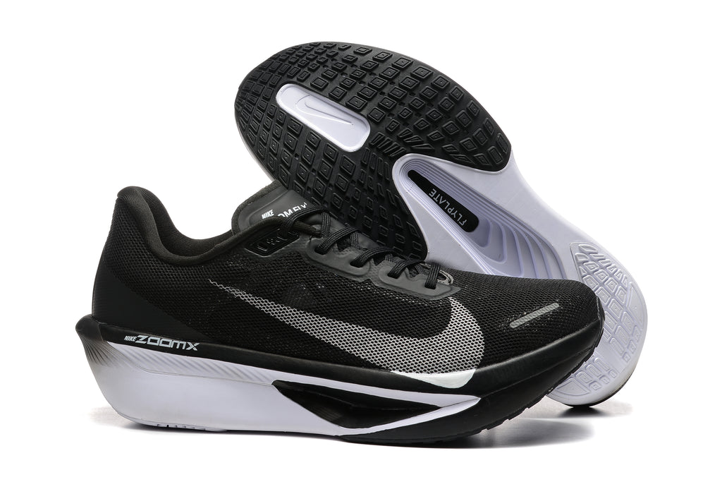 Black Nike Zoom Fly 6 side profile with white midsole and patterned outsole