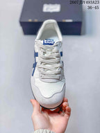 Top view of the white sneaker showing the lace-up closure, pale textured overlays and blue tongue label; overlay shows model code 2607JDY493A23 and size range 36–45.