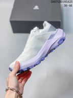 Side view of the white low-top shoe showing textured upper panels, lilac midsole accents, and a lugged outsole; overlay shows style code 2607GDD185A25 and size range 36–46.