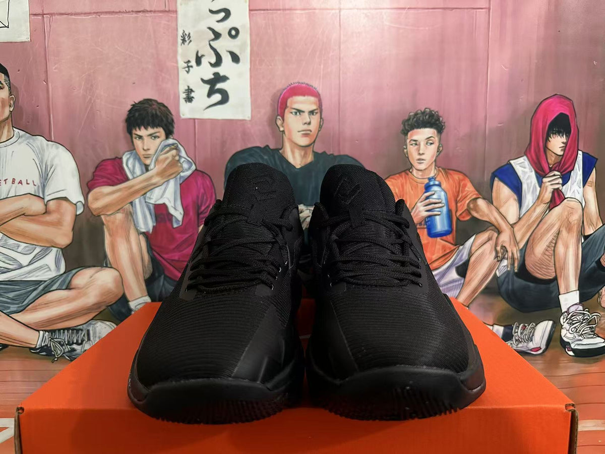 Front view of all-black Nike basketball shoes with laces and textured uppers.