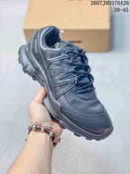 Angled side view of the black ECCO sneaker showing the layered upper and textured sole.