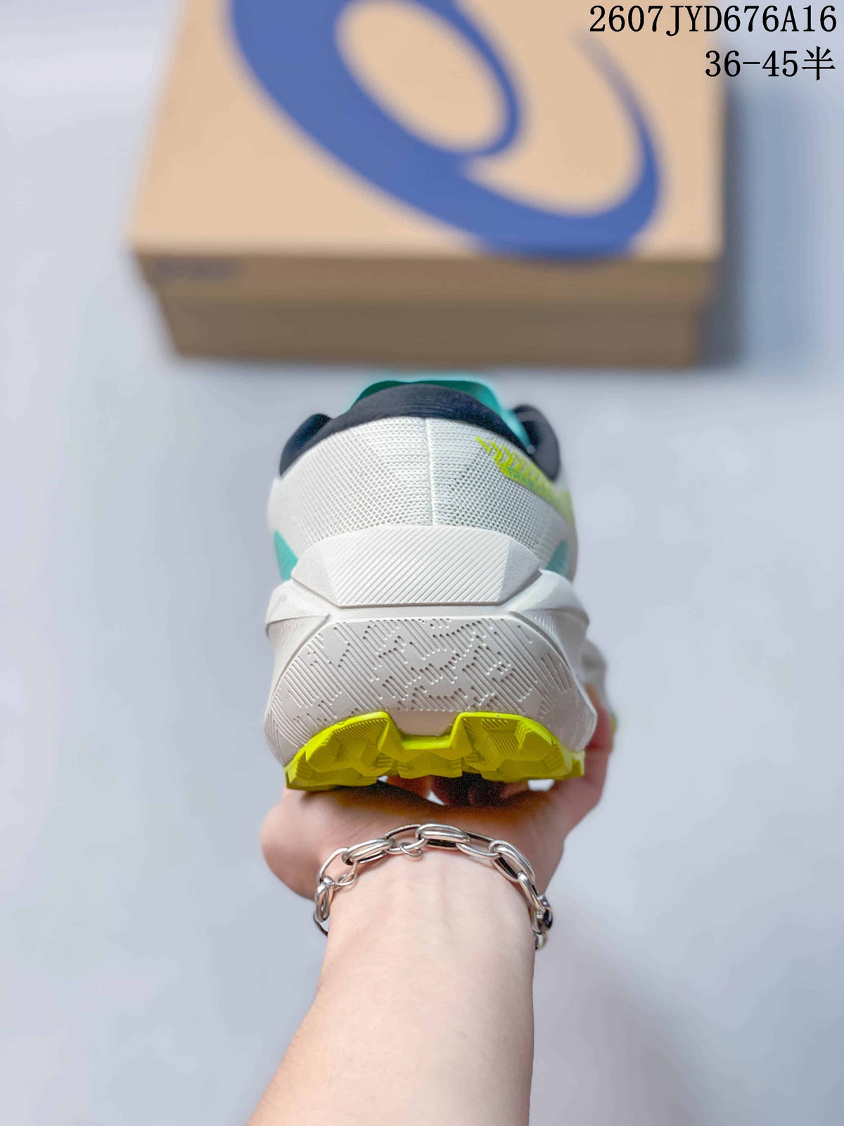 Rear view of the white trail running shoe showing the padded heel, layered midsole, and lime outsole sections.