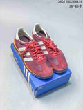 Pair of burgundy adidas SL 72 sneakers displayed on a blue adidas shoebox, with the style code and size range visible above.