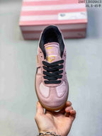 Top view of the pink sneaker showing black laces, pink panels and Palermo tongue branding.