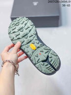 Close view of the lugged outsole with visible Vibram branding and geometric traction pattern.