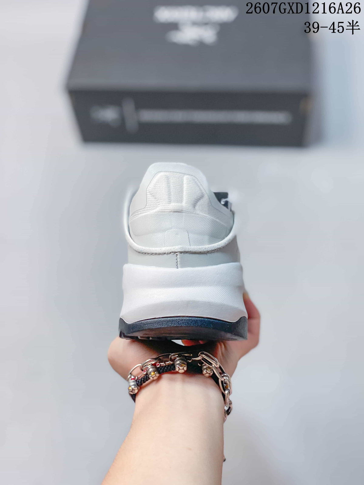 Rear view showing the padded heel, raised midsole structure and dark outsole edge.