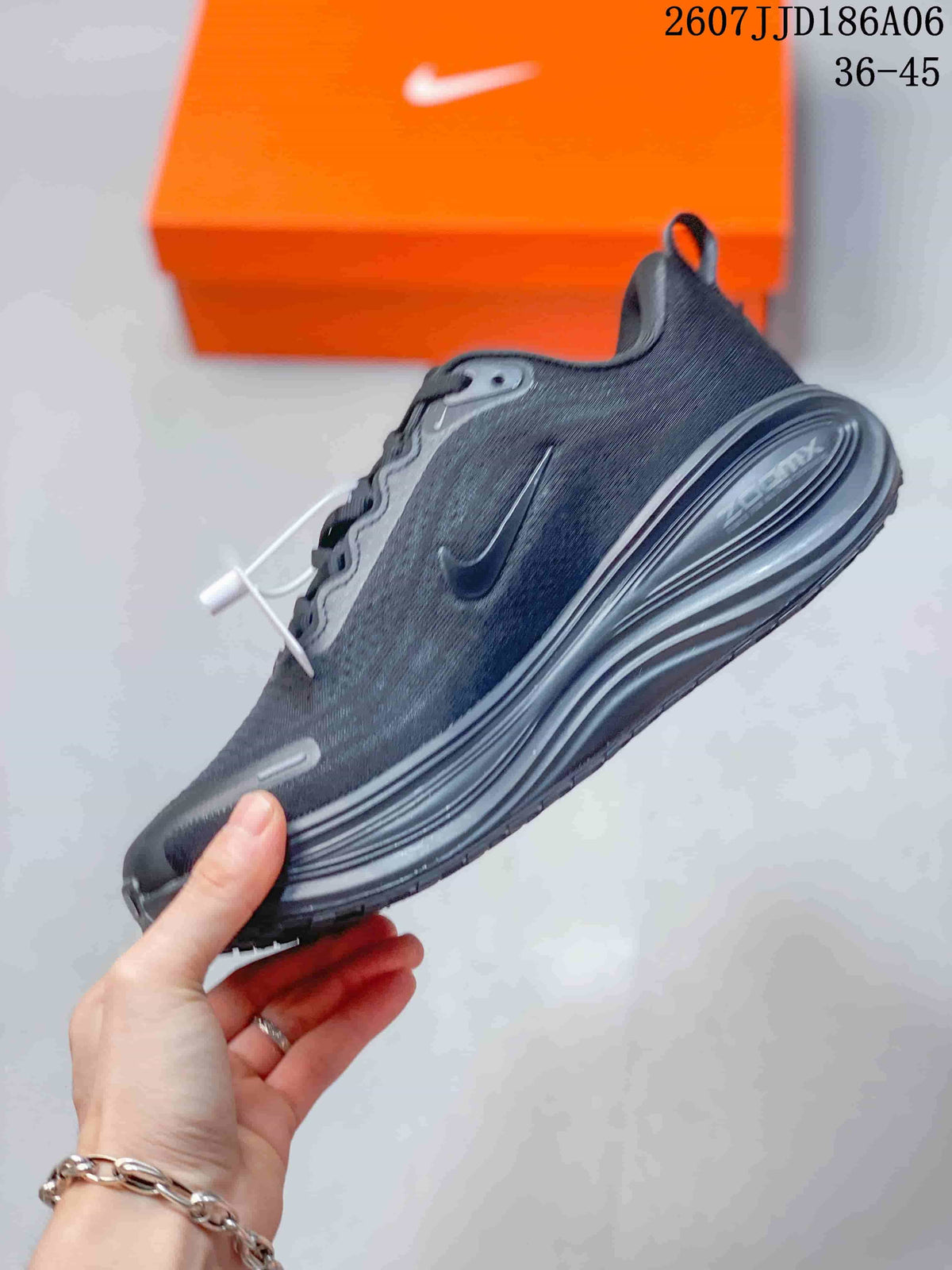 Side view showing the dark mesh-like upper, Nike Swoosh, and layered sole.