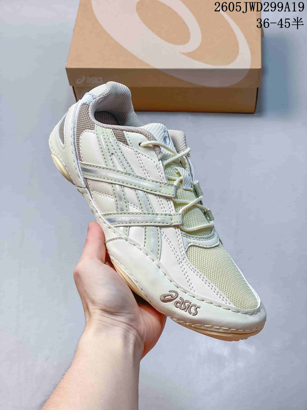 Side view of a pale ivory ASICS GEL-1130 sneaker.