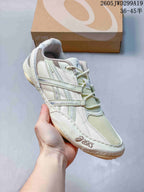 Side view of a pale ivory ASICS GEL-1130 sneaker.