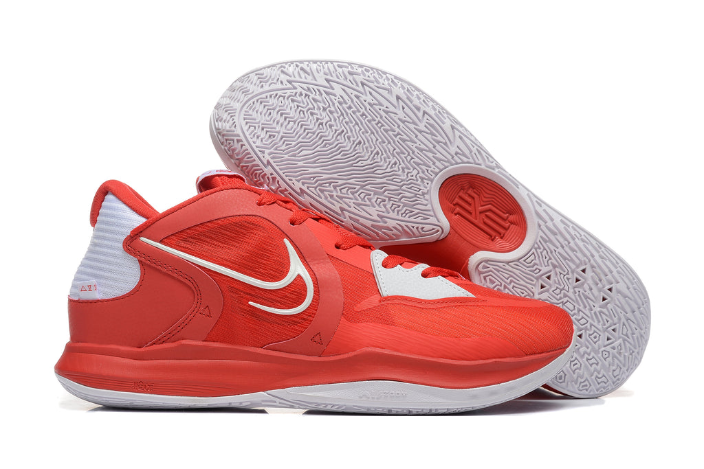 Red Nike Kyrie-style basketball shoe with white accents, shown beside its patterned outsole.