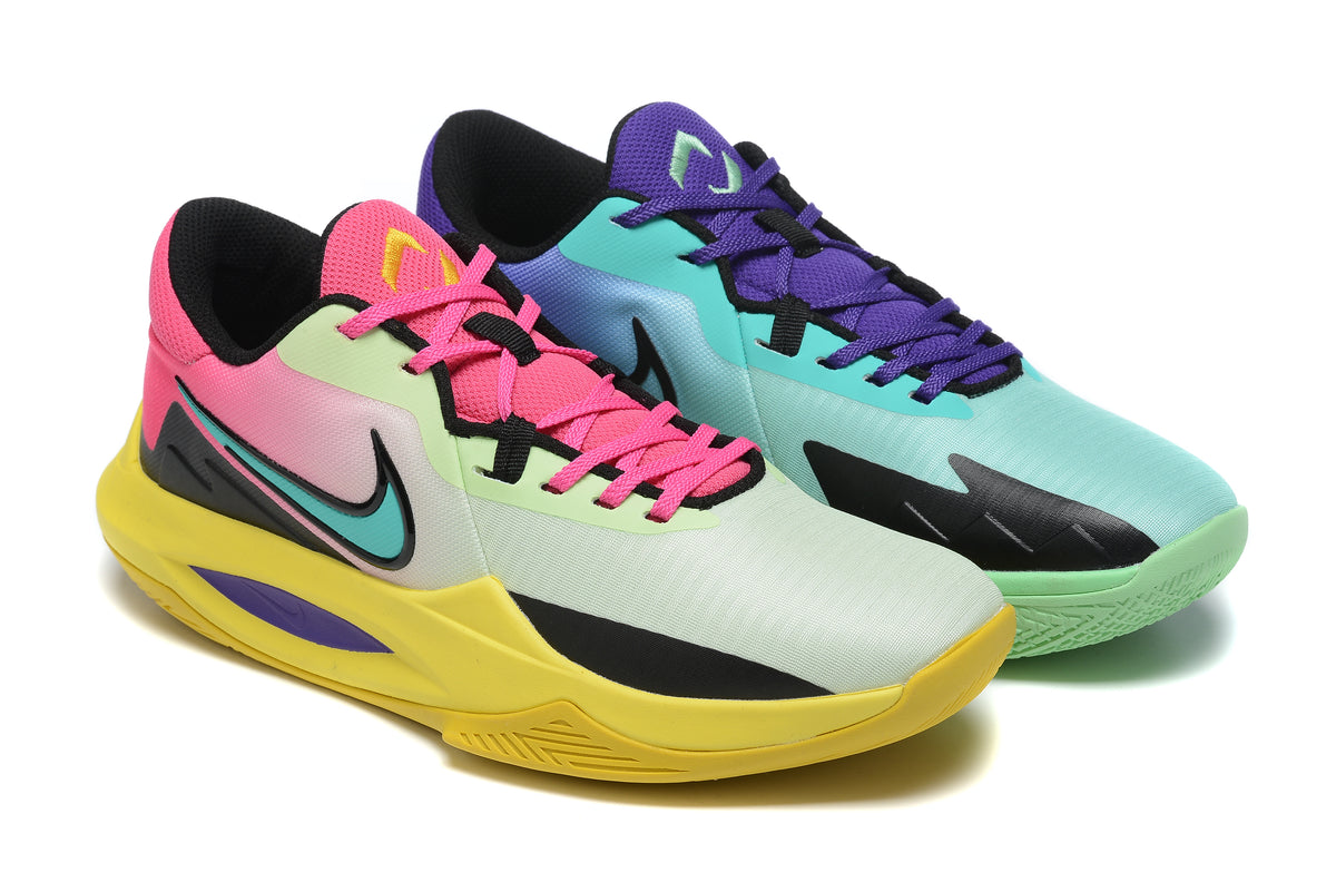 Two colorful basketball shoes in mismatched green, yellow, purple, and pink tones.