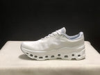 Clean lateral view of one ivory running shoe showing the low-top profile and white geometric outsole.