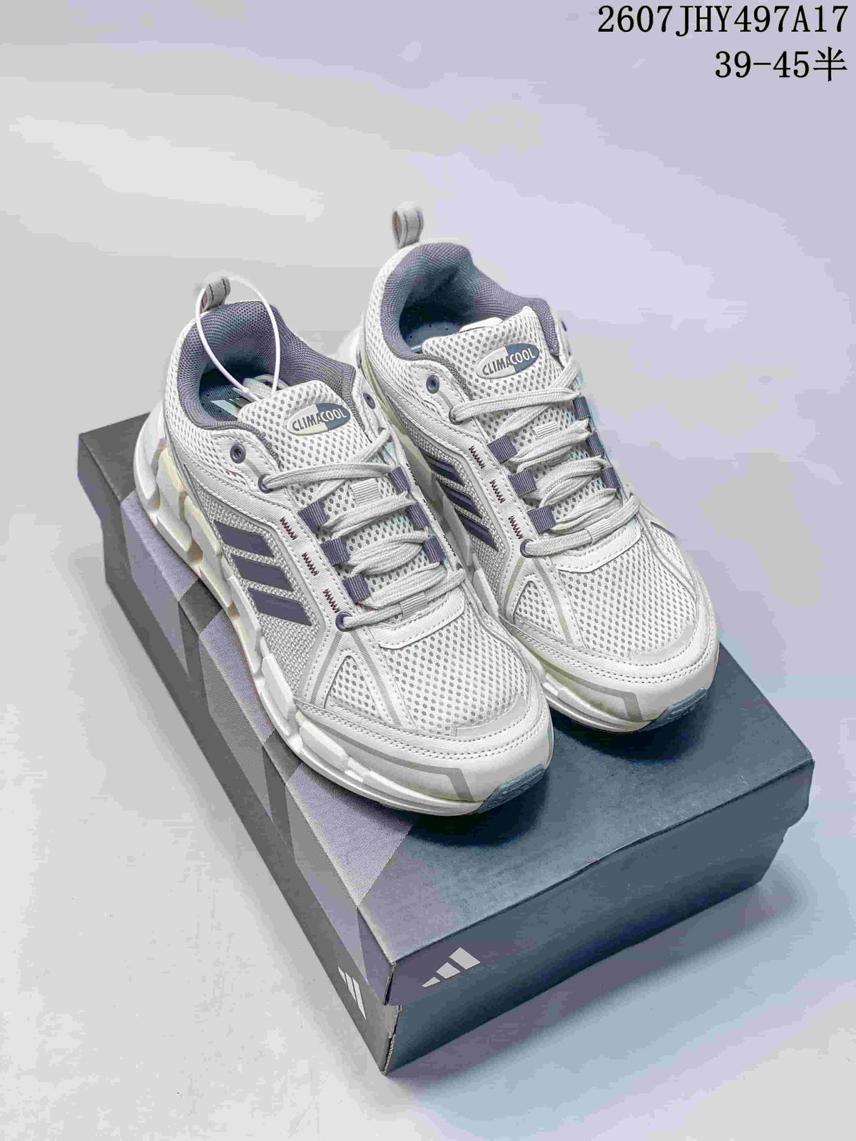 Pair of white and gray Adidas Climacool sneakers displayed on a shoebox, with navy accents and visible product code and size range text.