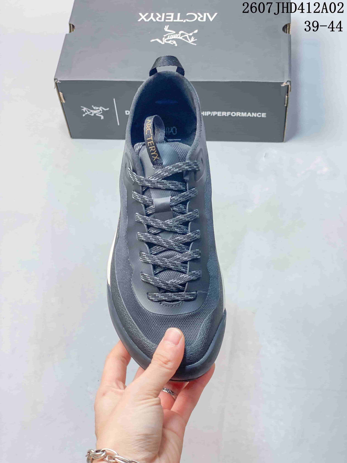 Top view showing the tongue, patterned laces, and toe area