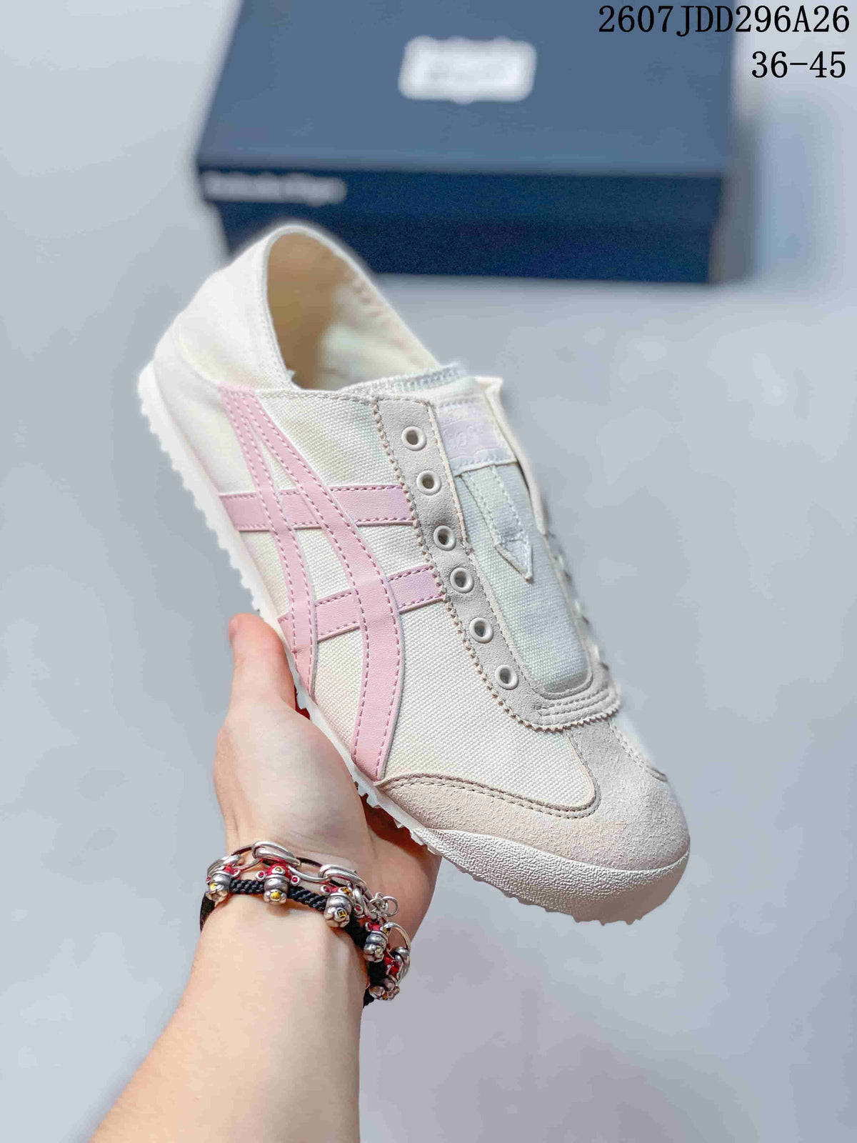 Angled side view of the ivory sneaker with pink stripes, textured overlays, and rubber outsole.