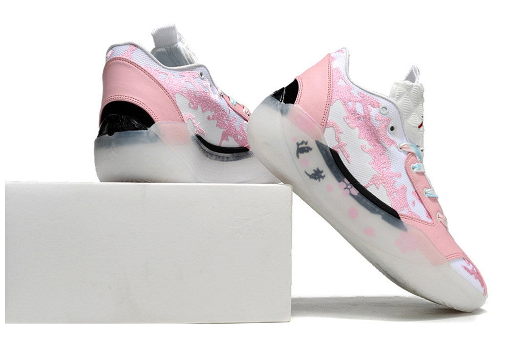 Pink and white Jordan 39 shoes shown from the heel and side.