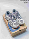 Pair of gray and white ASICS Gel-Kahana 8 FL sneakers displayed on an ASICS shoebox; size range text is visible at the top.