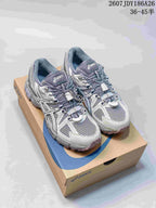 Pair of gray and white ASICS Gel-Kahana 8 FL sneakers displayed on an ASICS shoebox; size range text is visible at the top.