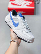 Angled side view showing the white and blue low-top sneaker, blue Swoosh, and black outsole.