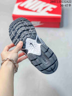 Underside view of a Nike V5 RNR sneaker showing the black textured outsole and sculpted white and black midsole sections; image text shows size range 36–47.