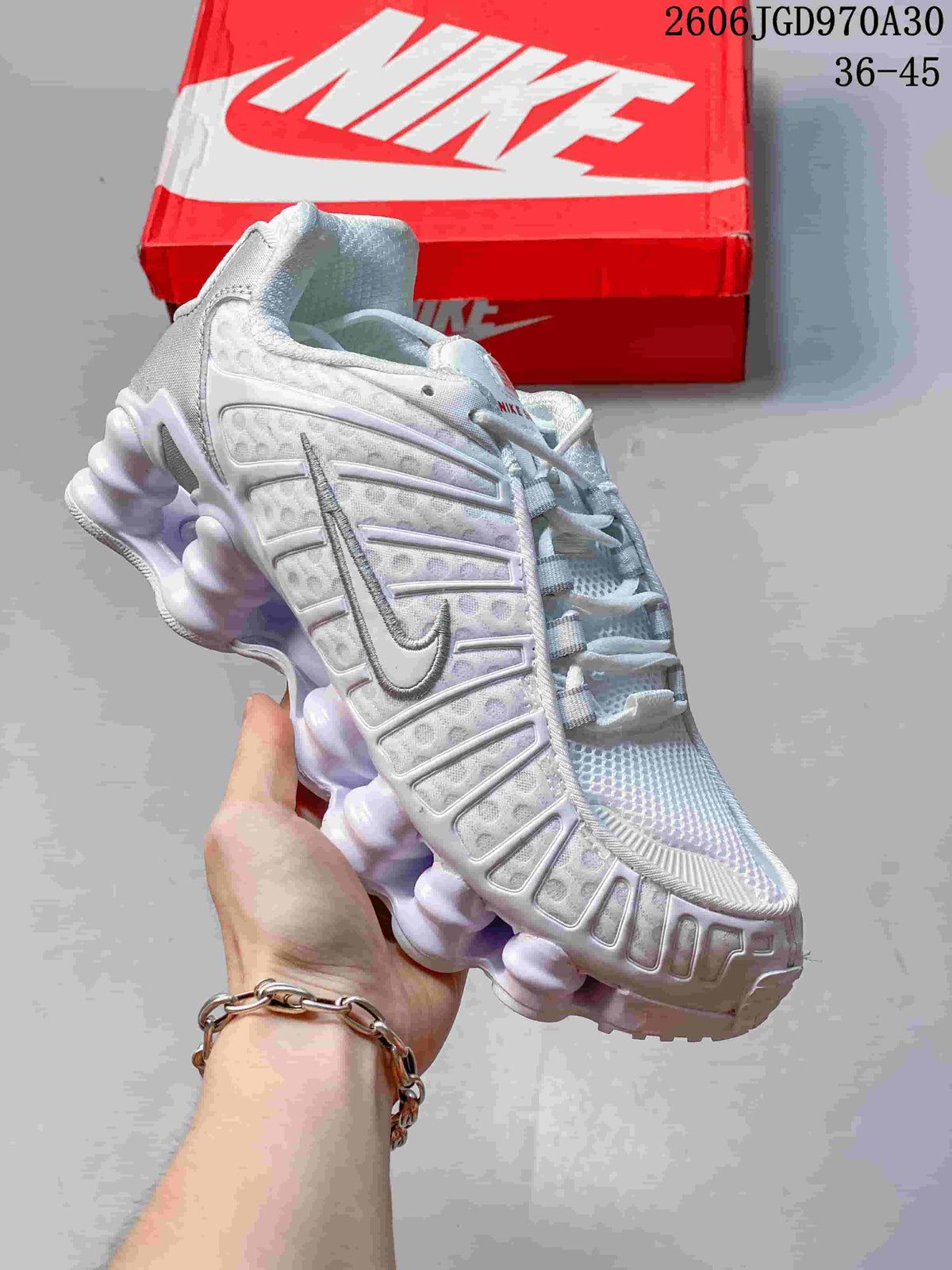 White Nike Shox TL sneaker with a light-colored segmented sole