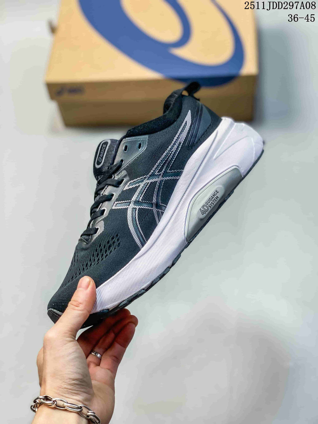 Side view of a navy and white ASICS sneaker showing layered side branding, textured upper, white midsole, and Guidance System marking.