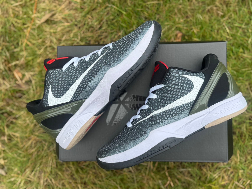 Angled side view of the shoes displayed on a shoebox