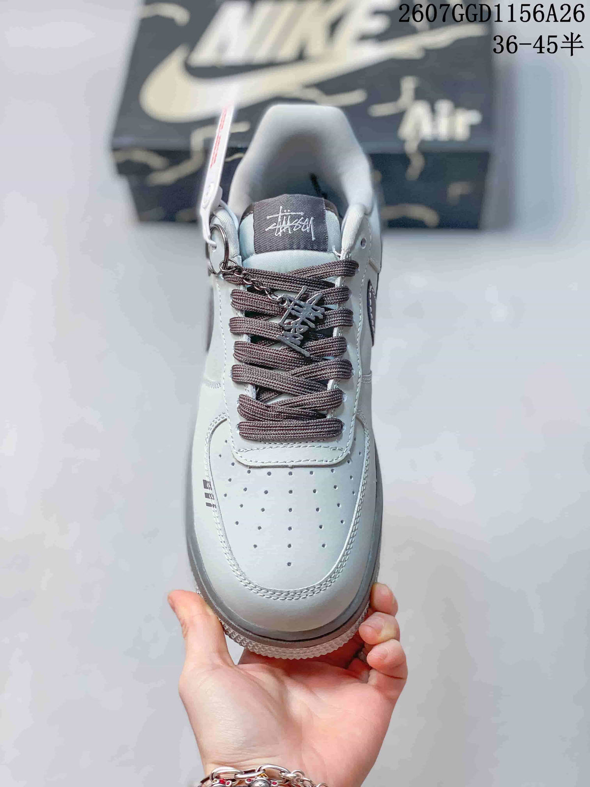 Top view showing the perforated toe box, textured laces, decorative lace hardware, and branded tongue.