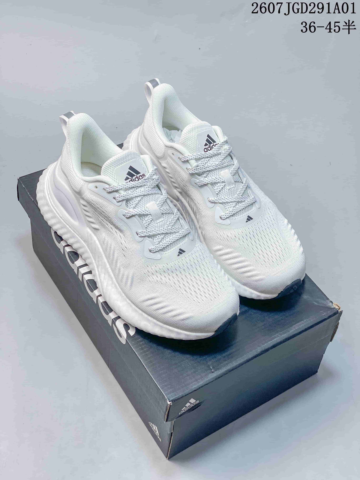 Pair of white adidas AlphaBounce Beyond sneakers on a shoe box