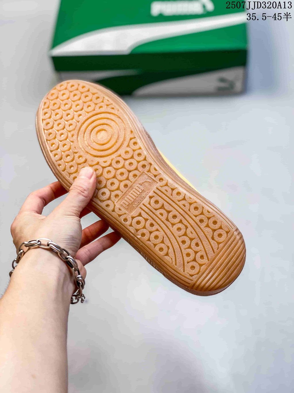 Close view of the gum-colored PUMA outsole showing its circular traction pattern.