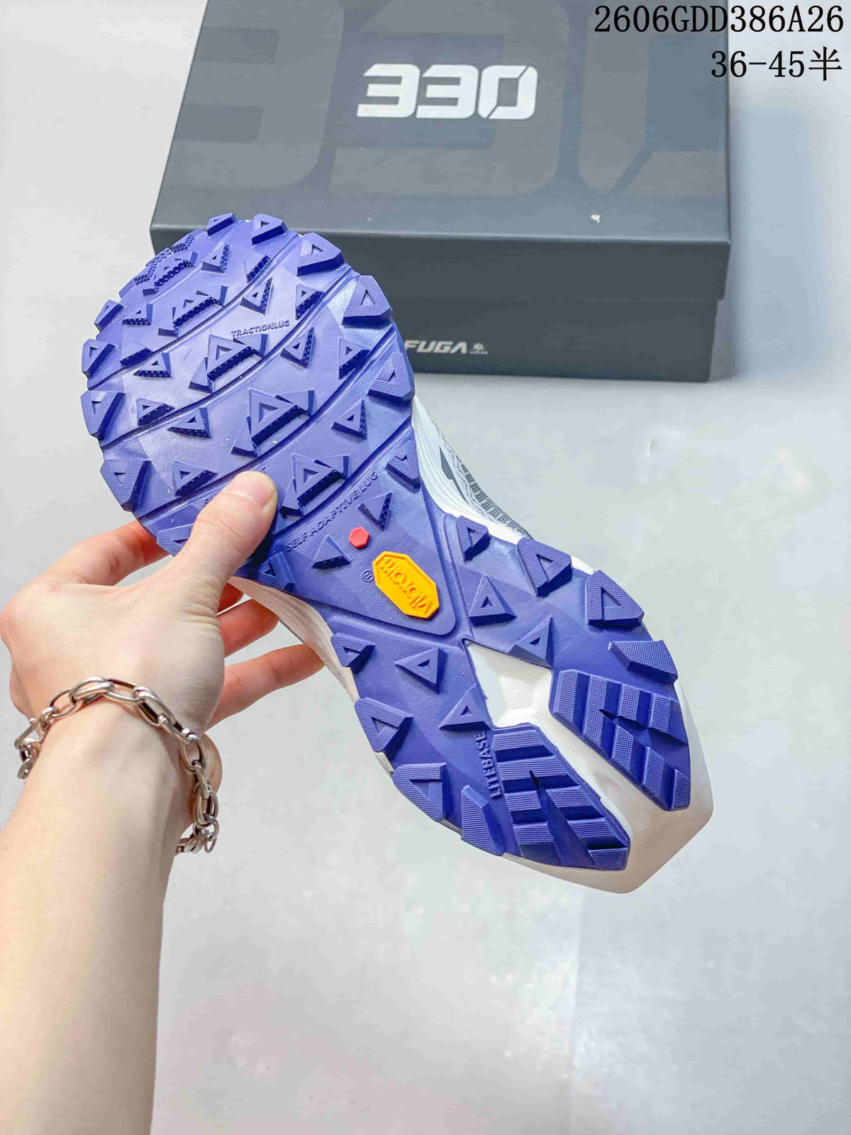Close-up of the purple lugged outsole on a Kailas FUGA EX330 trail shoe