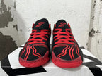 Front view showing red laces and tongue logos on black Jordan Tatum 1 shoes