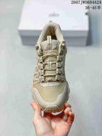 Top view of the sneaker showing the textured toe panel, padded tongue, and multi-point lace hardware.