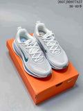Pair of white Nike Structure Plus sneakers with teal accents displayed on an orange shoebox; overlay text shows style code 2607JHD977A27 and sizes 36–40.5.