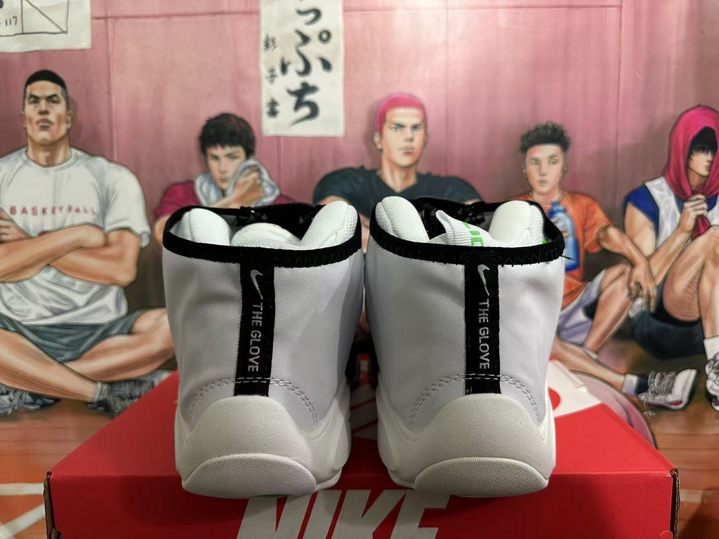 Rear view of white and black Nike The Glove high-top basketball shoes with heel lettering