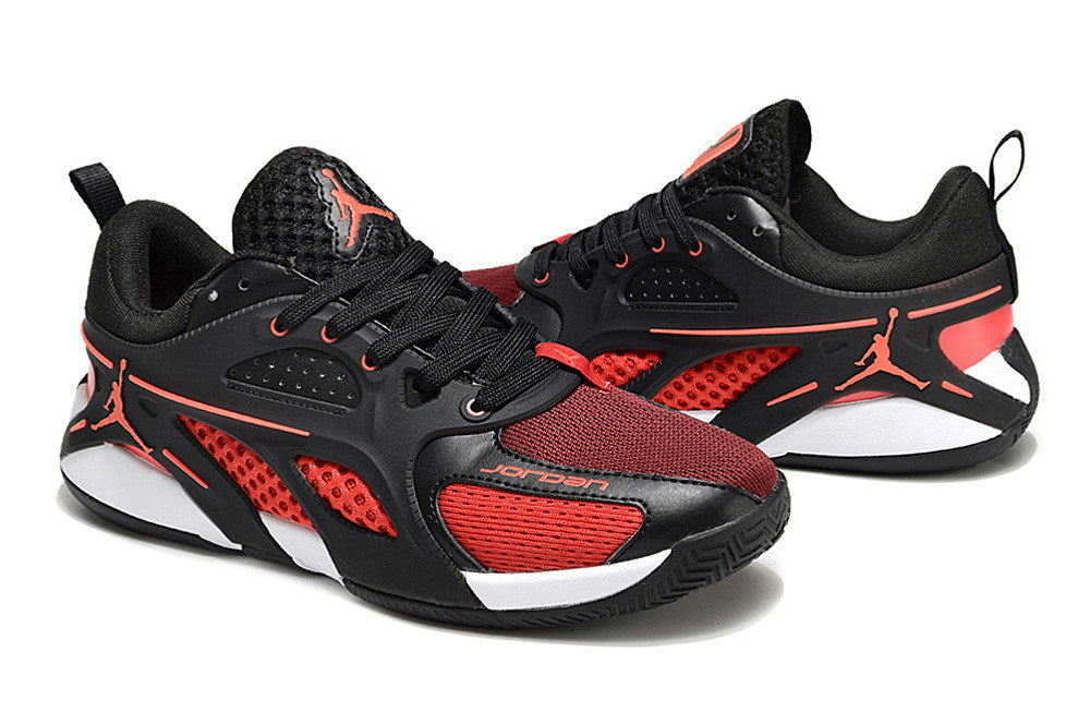 Side view of black and red Jordan Heir shoes