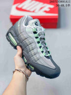 Angled side view showing the layered upper, mesh toe area, black outsole, and visible green-tinted air units.